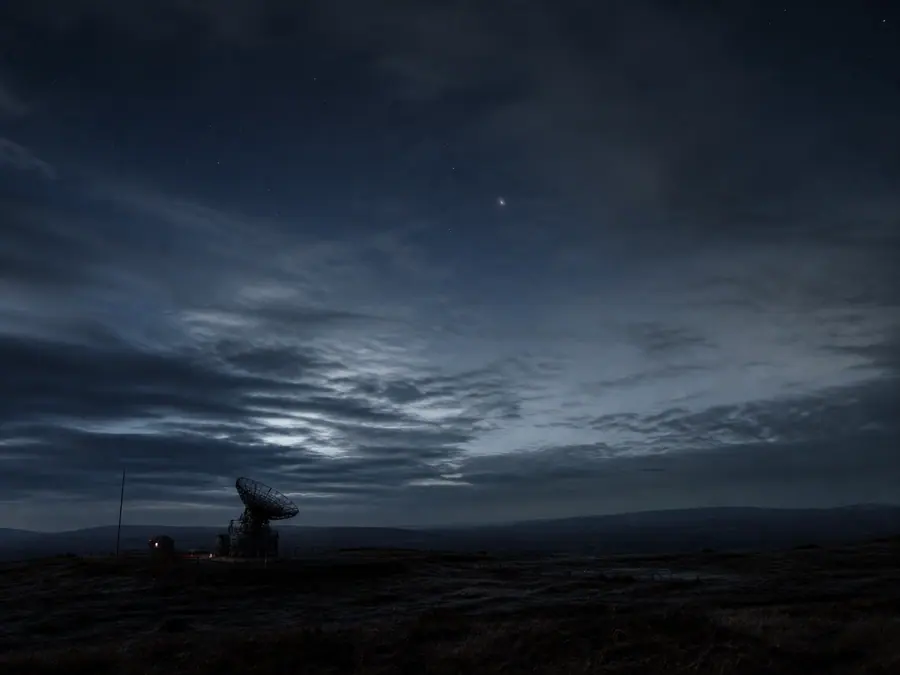 A distant unexplained light above a moorland observation station